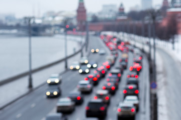 Blur traffic road with colorful bokeh light and old building town abstract background