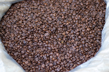 Coffee beans close-up in sack. It was photographed in front of the coffee shop.