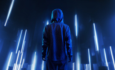 Back view of hacker in hoodie. Dangerous hooded hacker. Internet, cyber crime, cyber attack, system...