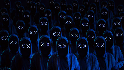 Masked hackers army. Dangerous hooded group of hackers. Internet, cyber crime, cyber attack, system breaking and malware concept. Dark face. Anonymous.