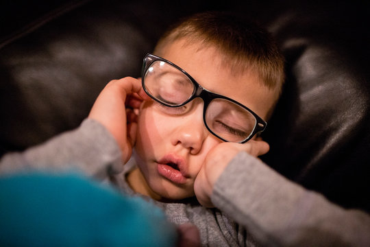 Young tired boy fell asleep suddenly