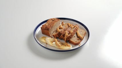 Sliced banana bread, peanut butter and banana