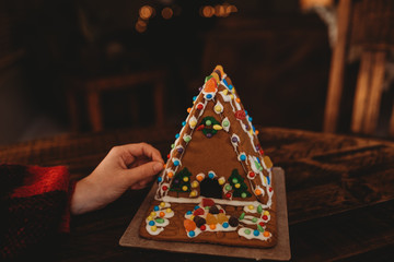 Putting finishing touches on a Ginger Bread House