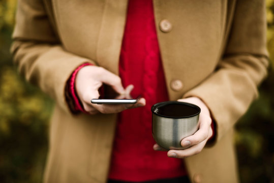 Woman Holding Her Phone  outdoor