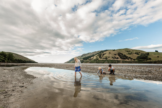 Siblings looking for shellfish on the South Island of New Zealand