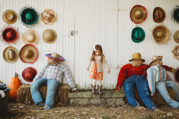 Fall pumpkin farm day with little girl