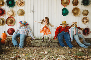Autumn  fun in the Midwest with children jumping