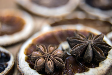 Dried citrus fruits with cinnamon, star anise on white background. Mulled Wine Ingredients.