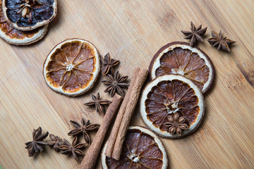 Dried citrus fruits with cinnamon, star anise on white background. Mulled Wine Ingredients.