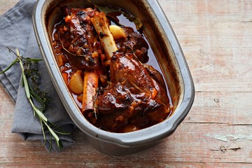 Slow cooked lamb shanks with herbs and spices. Copy space © losangela