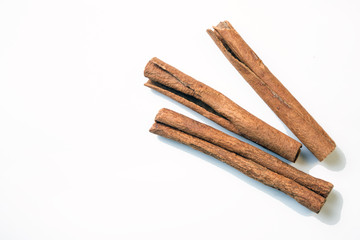 Cinnamon sticks on white background. Top view