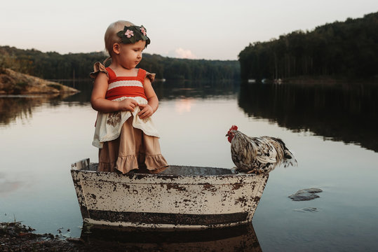Moana themed dress with girl and chicken on boat in lake