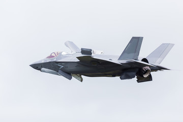 Fototapeta na wymiar F-35B stealth fighter slows into a hover