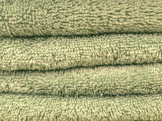 Fototapeta na wymiar terry towel texture green bathroom close up
