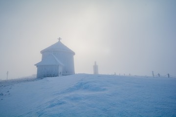 chapel on peak of Sniezka mountain in Giant Mountains in Poland and Czech republic border during...