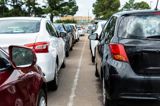 Line Of Bland Cars On Airline Rental Agency Lot