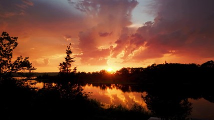 Glorious golden sunset time lapse with big fluffy clouds