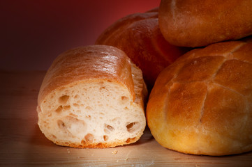 a group of rolling bread on a pile