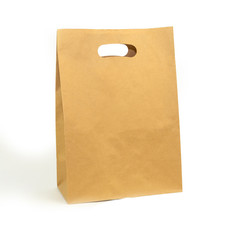 gray paper bag on a white background. concept of rejection of plastic bags. close-up.