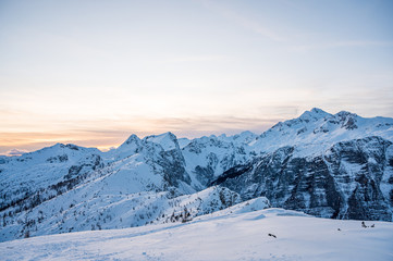 Fototapeta na wymiar Spectacular winter mountain panoramic view of mountains at sunset.
