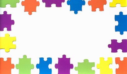 colored puzzle on wooden boards team business concept