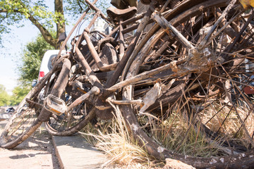 Rusty bicycles fished out of canal in Amsterdam  