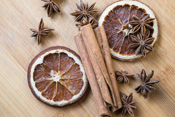 Fototapeta na wymiar spices on a wooden Board. Anise, star anise, cinnamon and oranges