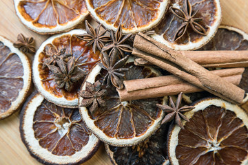 spices on a wooden Board. Anise, star anise, cinnamon and oranges