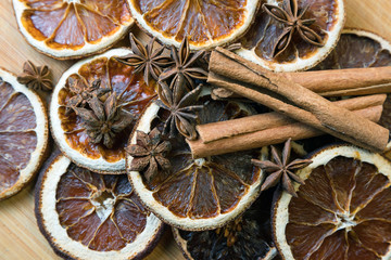 Fototapeta na wymiar spices on a wooden Board. Anise, star anise, cinnamon and oranges