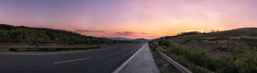 Pink sunset on the road