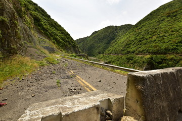 Fallen rocks on the road in Manawatu Gorge North Island New Zealand
