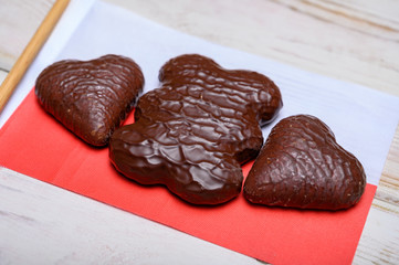 Tasty gingerbread glazed cookies from Torun, Poland and flag of Poland