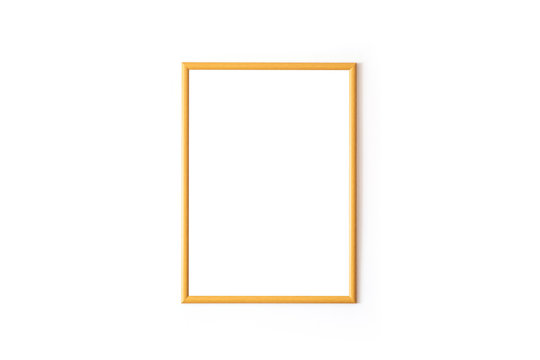 Empty wooden square frame in front of white wall