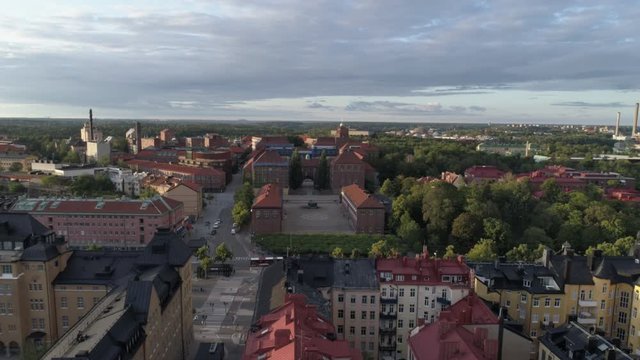 Aerial view of KTH Royal Institute of Technology building in Stockholm, Sweden. Drone shot flying over apartment buildings, KTH university