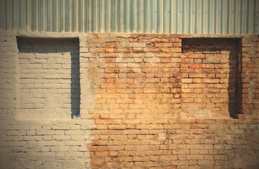 old brick wall with blind windows