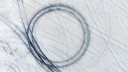 Tire tracks from off-road vehicles in the salt create graphic, geometric shapes at the Bonneville...