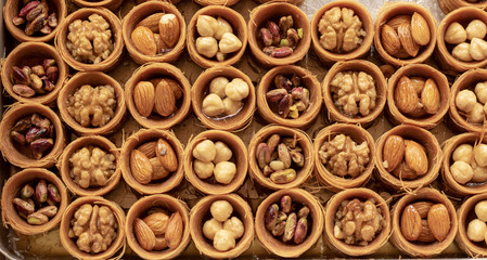 Round kadayif filled with peanuts. There are different kinds of nuts.