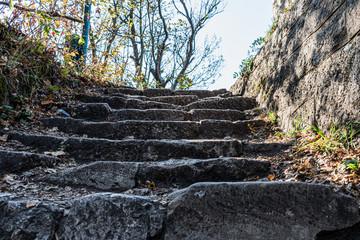 old stone stairs on a mountain road in Romania. closeup macro shoot. forest road