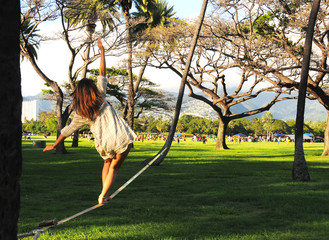Slacklining Kapiolani Park Oahu Hawaii USA daredevil girl, challenge, freedom, youth