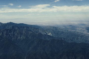 Beautiful view of mountains while watching out of the plane window approaching Los Angeles