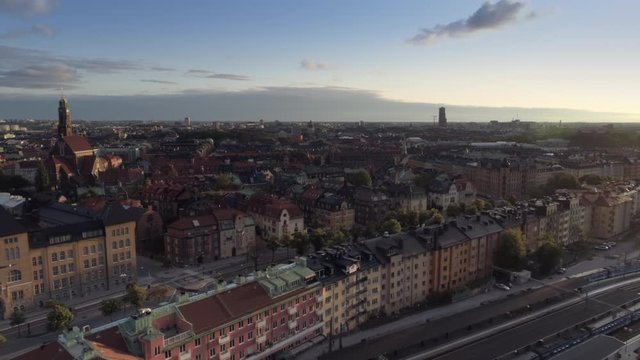 Stockholm skyline at sunset aerial view. Drone shot flying over Stockholms &ouml;stra station and apartment buildings. Engelbrekt Church and downtown cityscape in The Capital City of Sweden