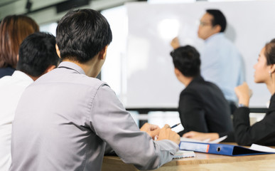 business man and his team presentation and meeting in modern office design planning ideas concept