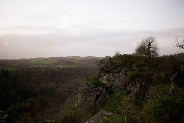 Fototapeta premium Cliff with the horizon in clouddy and foggy sky