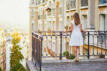 Beautiful young woman enjoying scenic view of Paris, France