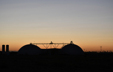 Fototapeta na wymiar Sunset at fertilizer factory