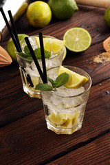Lemon Fruit Lime Caipirinha of Brazil. Cocktail with lemon and mint