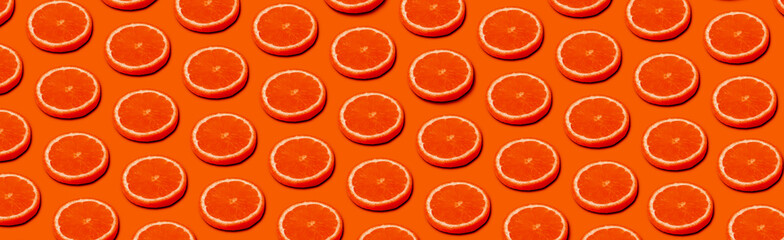 pattern with orange citrus fruits on a orange background, panoramic  image in pop art style