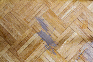 Old parquet floor with scratch marks; indoor hardwood flooring needing refinishing - obrazy, fototapety, plakaty