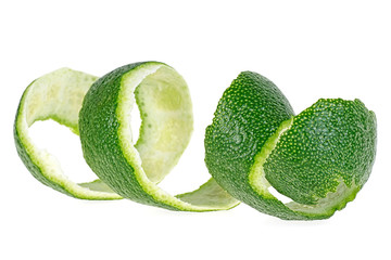 Fresh peel of lime fruit isolated on a white background. Citrus twist peel.