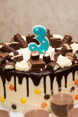 Chocolate birthday cake for a third birthday or anniversary celebration. Number three birthday